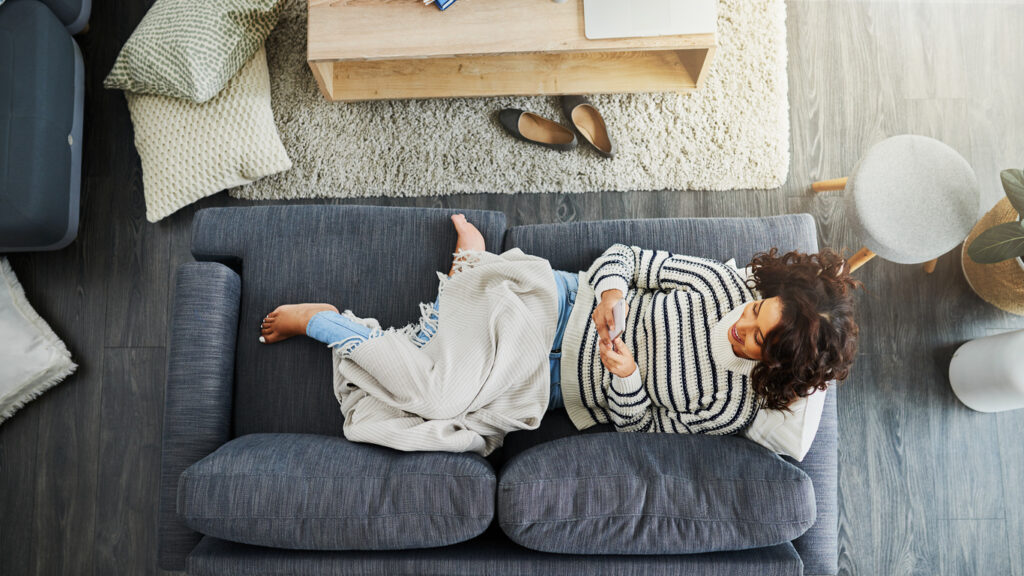 woman laying on couch