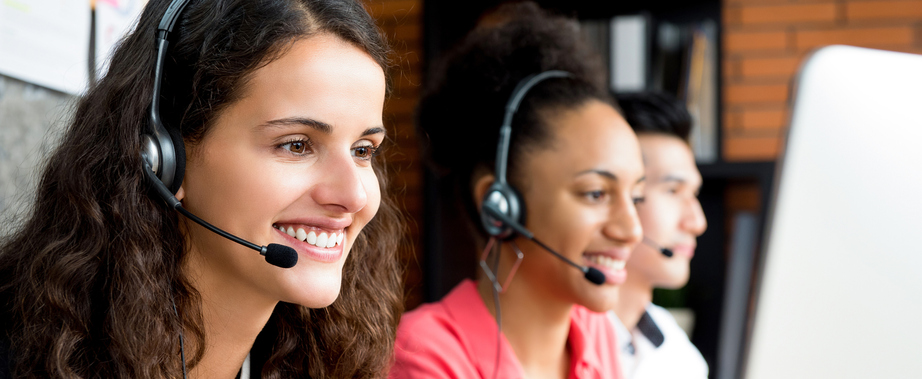 Group of multiethnic smiling call center team - panoramic web banner