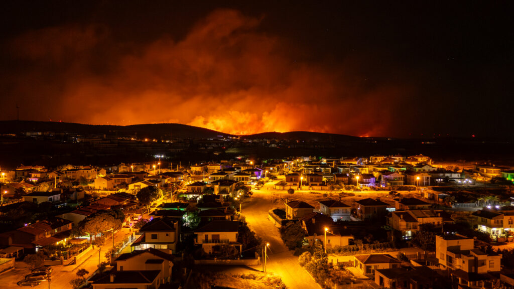 Massive wildfire burning near residential area