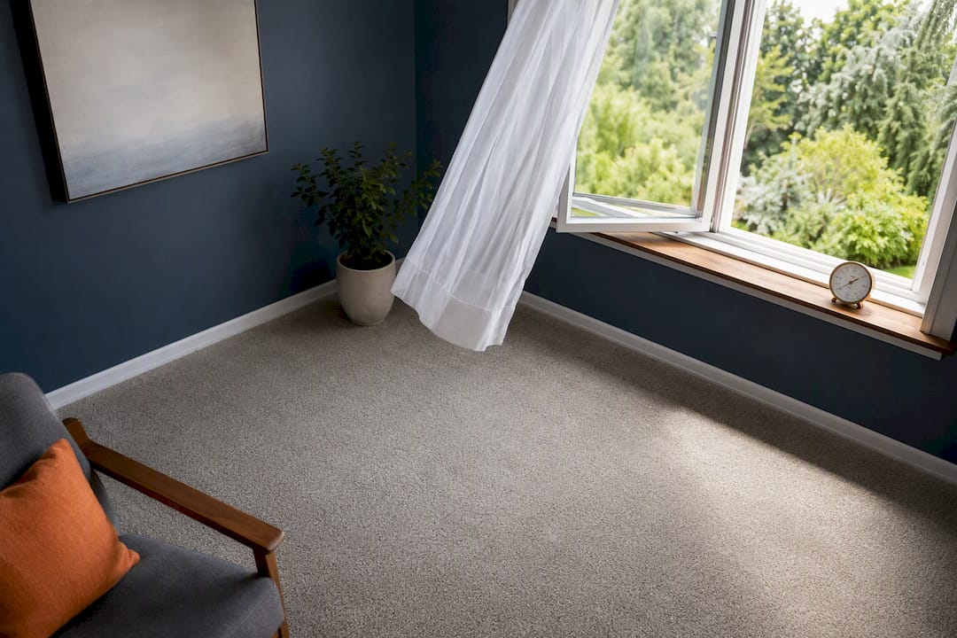 Open window ventilating a newly carpeted room